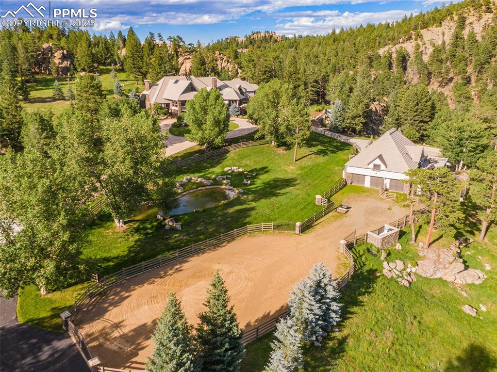 Image 35 of 38: The arena outside the guest home is used for parking when entertaining.	
