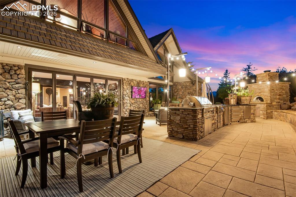 Image 8 of 38: Step outside onto the patio to barbeque, cook a pizza in the pizza oven, la