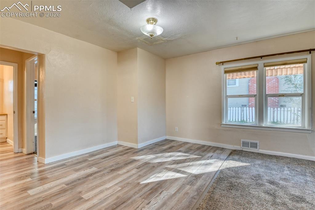 Image 12 of 30: Main house dining room/living room combo