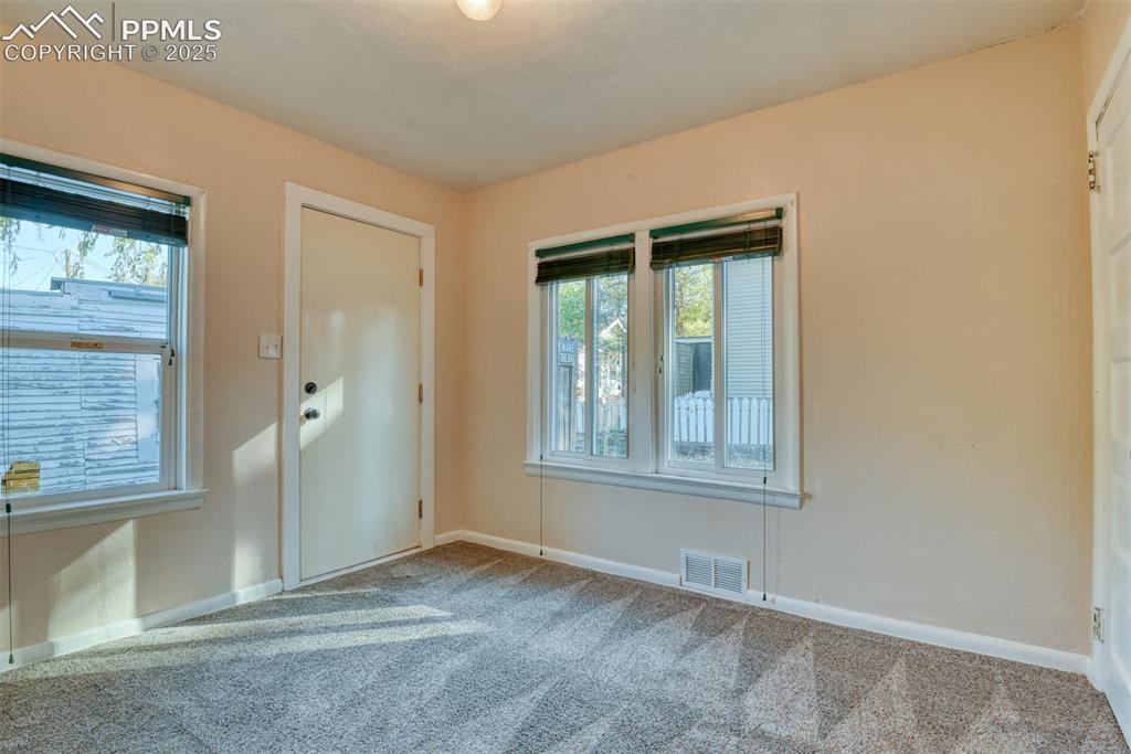 Image 16 of 30: Main house 3rd bedroom with back yard access