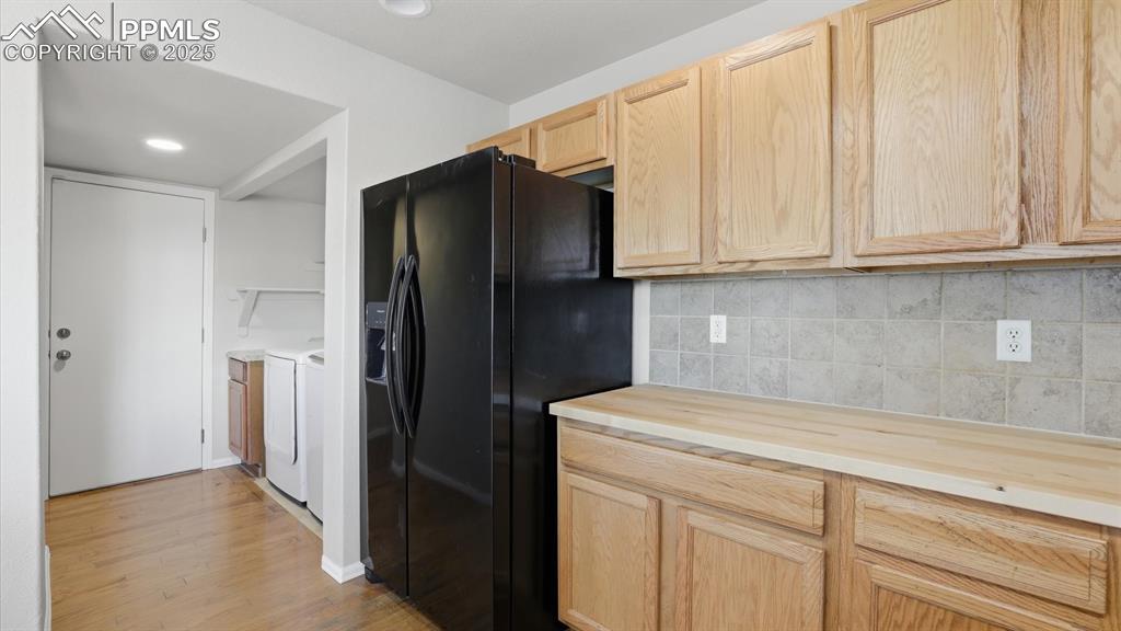 Image 11 of 45: The Laundry Room is located off the Kitchen.