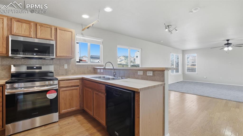 Image 15 of 45: Kitchen, Dining Area, and Living Room.