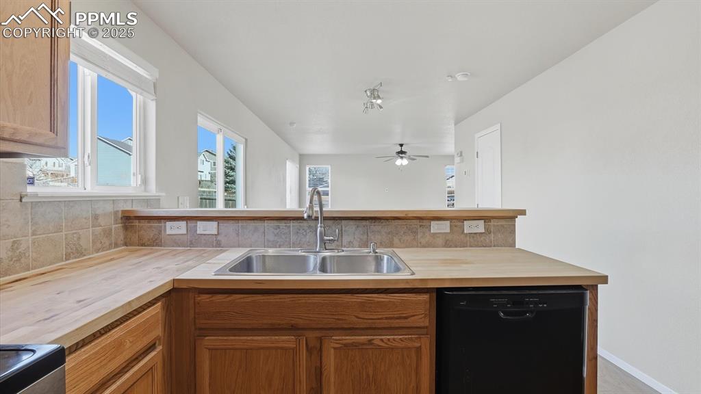 Image 16 of 45: The Kitchen overlooks the Dining Area making it simple for food service and