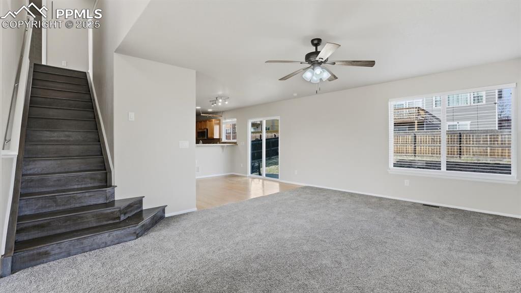 Image 18 of 45: Stairs to the upper level from the Living Room.