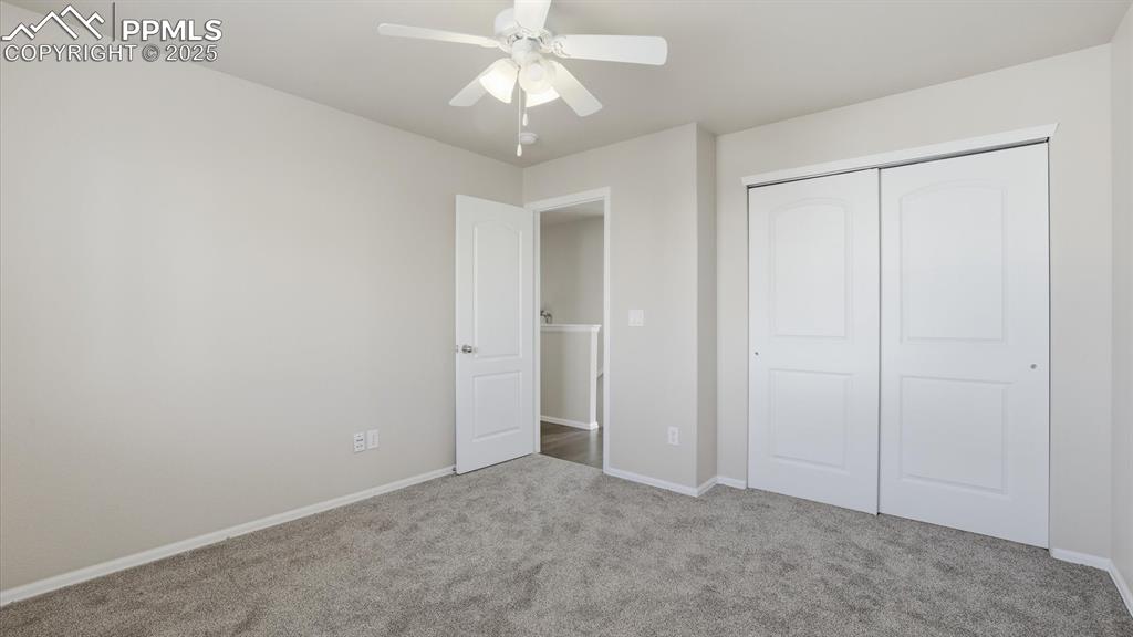Image 25 of 45: Upper Level Bedroom #2 with generous closet.
