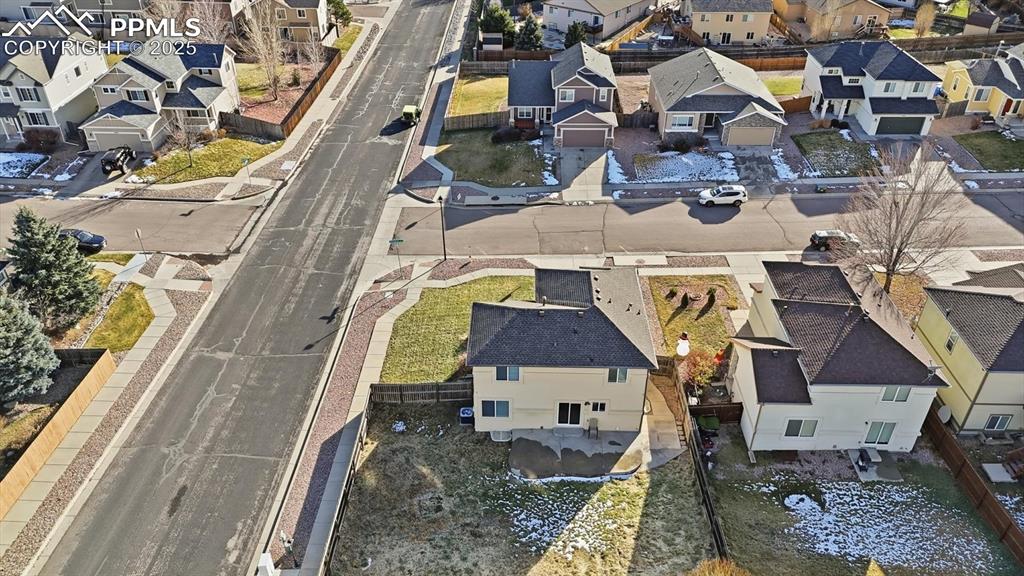 Image 43 of 45: Aerial view of home and corner lot.