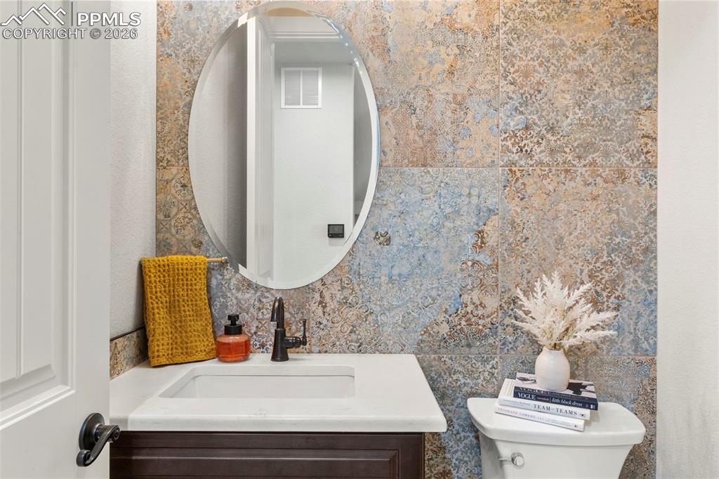 Image 16 of 50: Stunning Boho Chic Powder room on main level