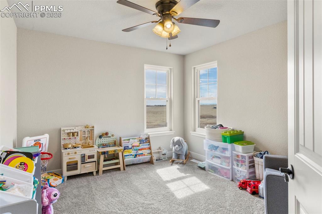 Image 25 of 50: Upstairs Bedroom #2 with unique corner window offering excellent views