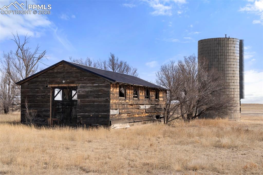 Image 35 of 50: Rustic and historic shed and silo