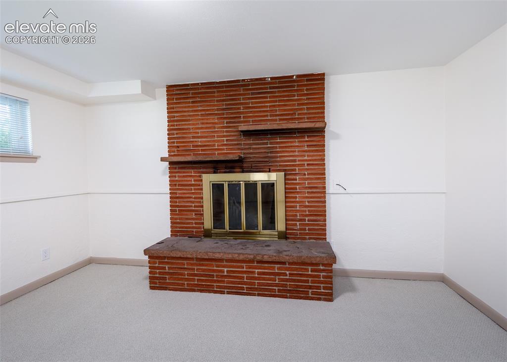 Image 28 of 45: Fireplace in Family Room