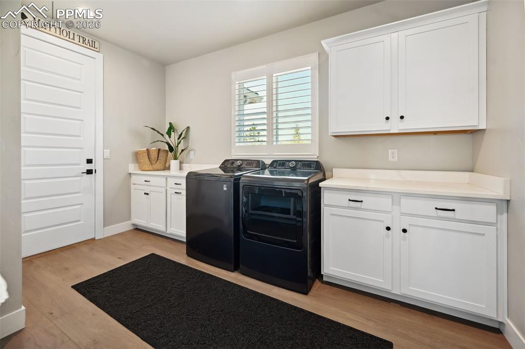 Image 4 of 43: Garage entrance to mud/laundry room