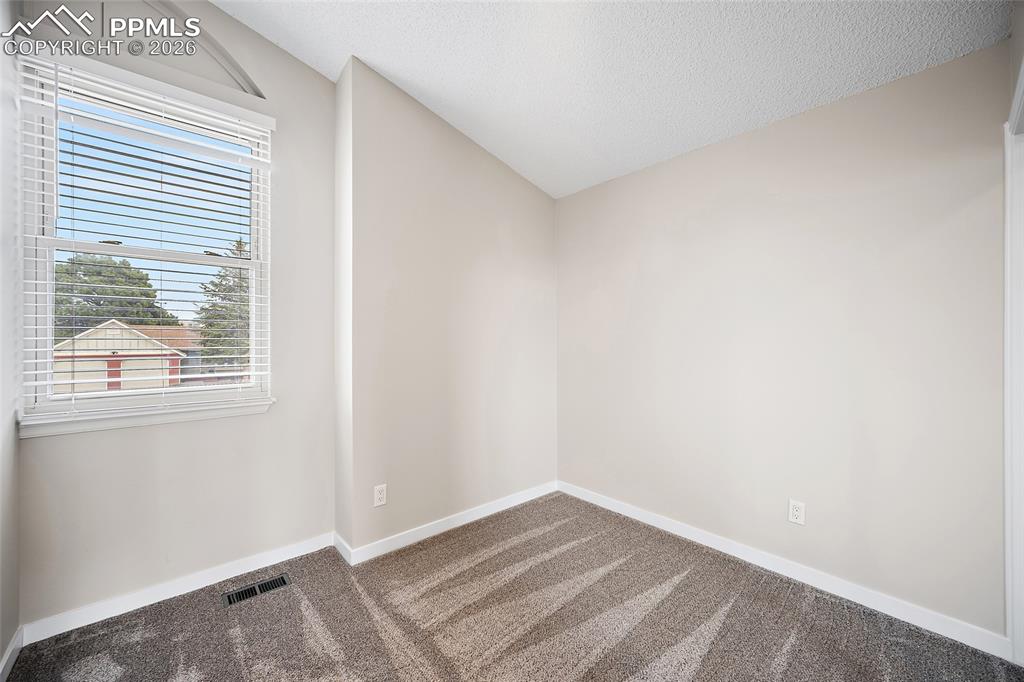 Image 32 of 38: Bedroom