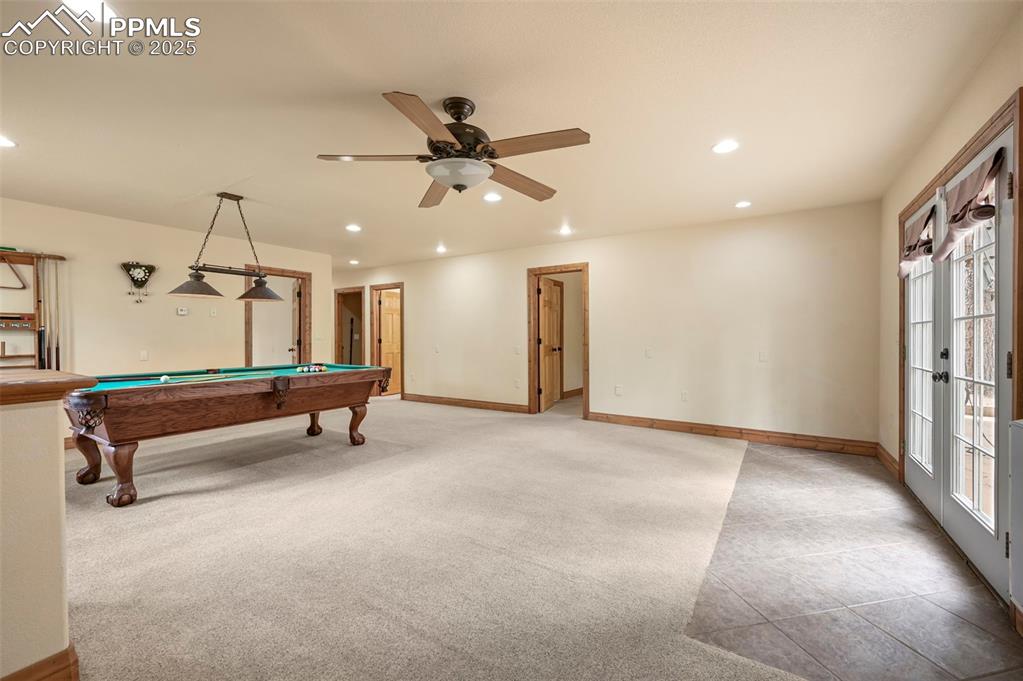 Image 27 of 43: Game room and walk out patio