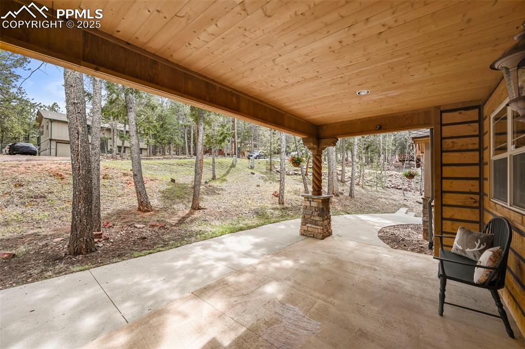 Image 4 of 43: Fully covered front patio