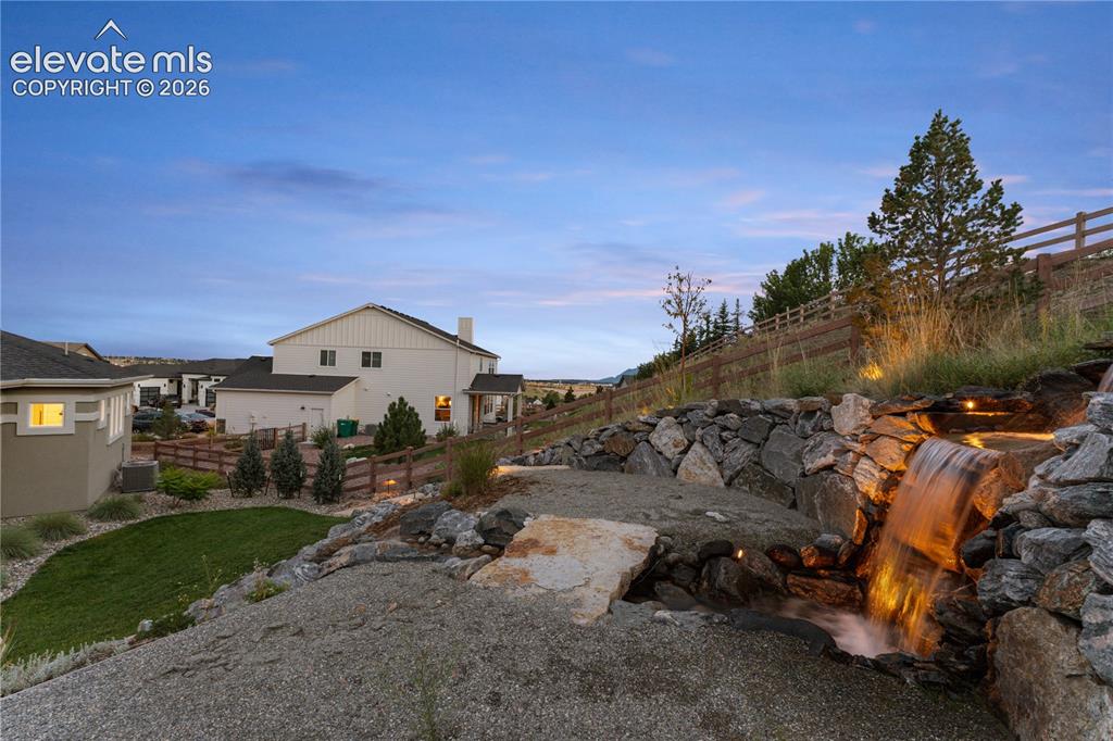 Image 3 of 45: One of the largest custom waterfall features in Flying Horse.