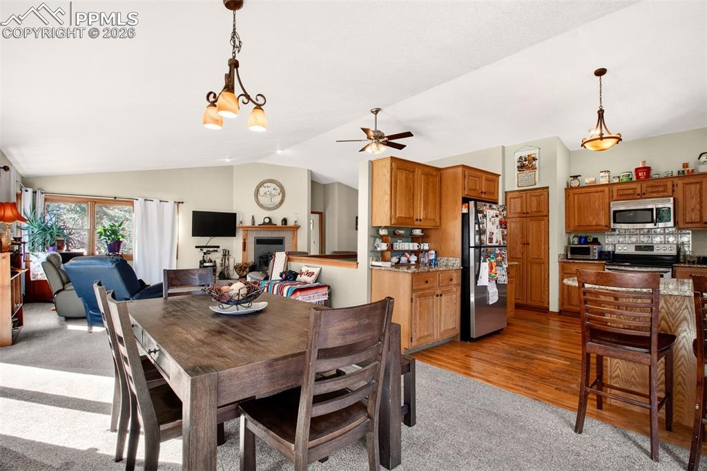 Image 13 of 43: Additional view of the open concept main area highlighting the dining area