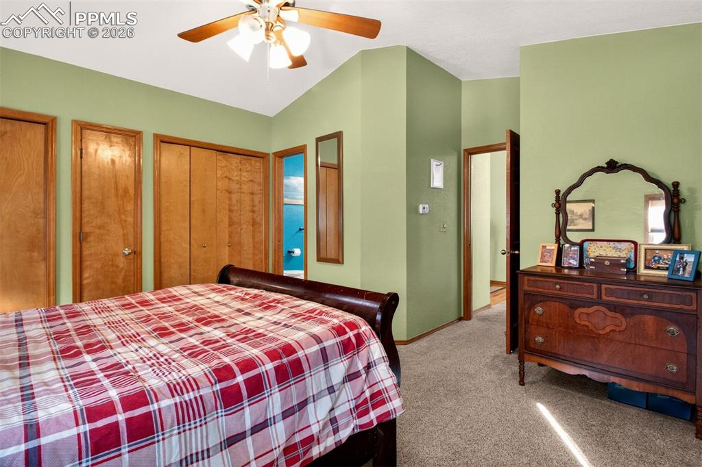 Image 18 of 43: Primary bedroom with en suite bathroom and a private walk out deck