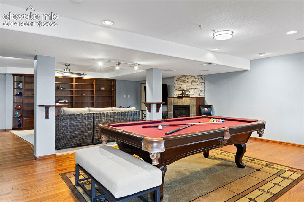 Image 41 of 50: Hardwood-finish flooring throughout, complemented by recessed lighting and