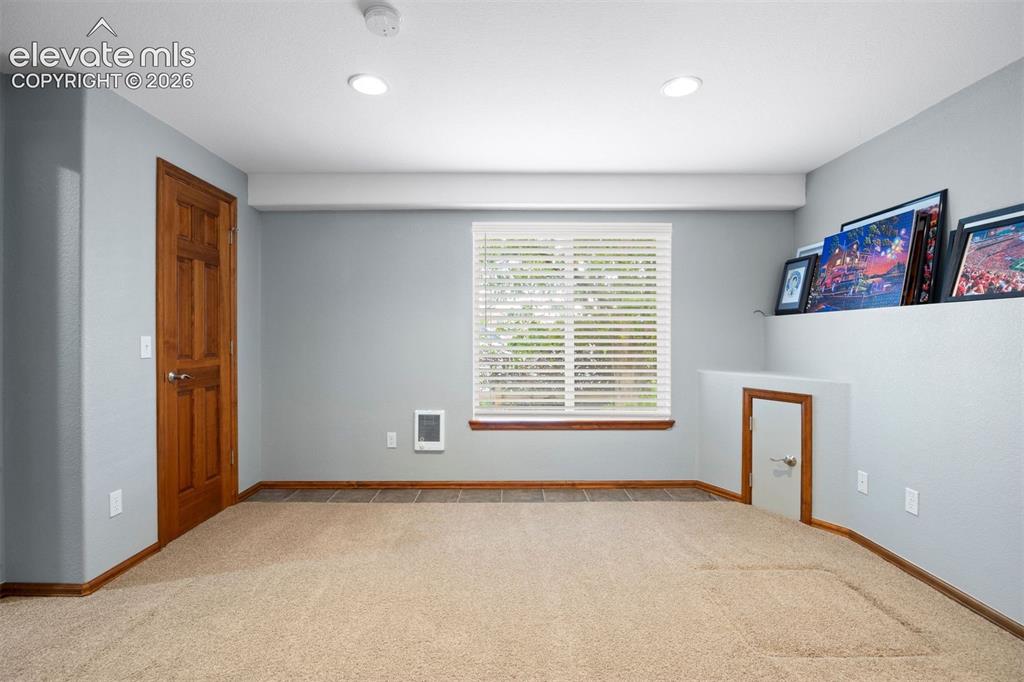 Image 43 of 50: Basement bedroom