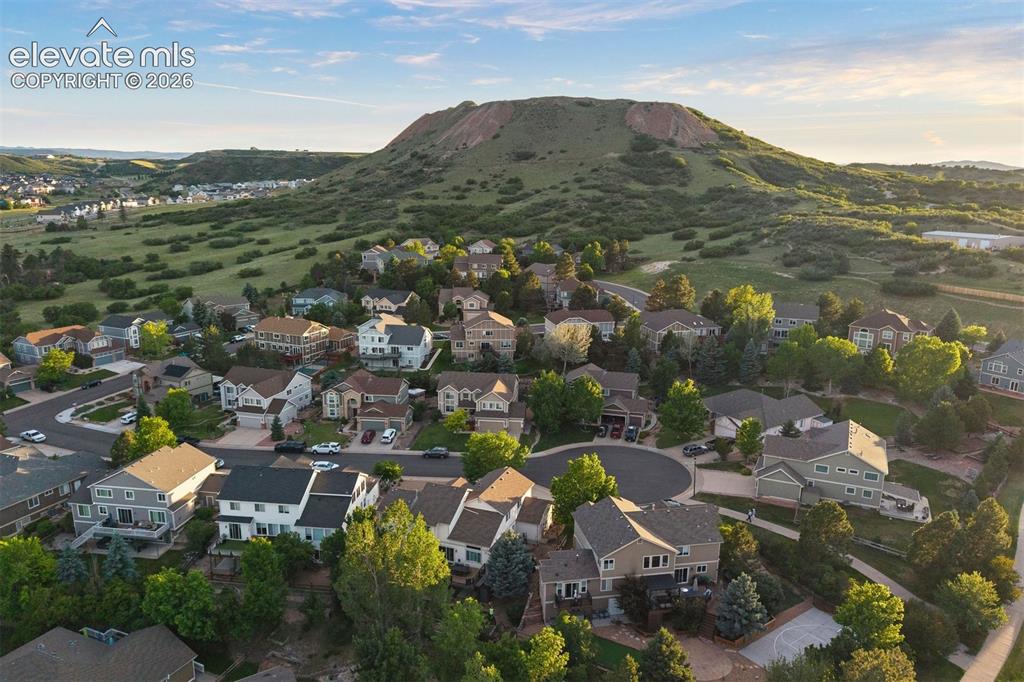 Image 46 of 50: Residential neighborhood with a variety of architectural styles, surrounded