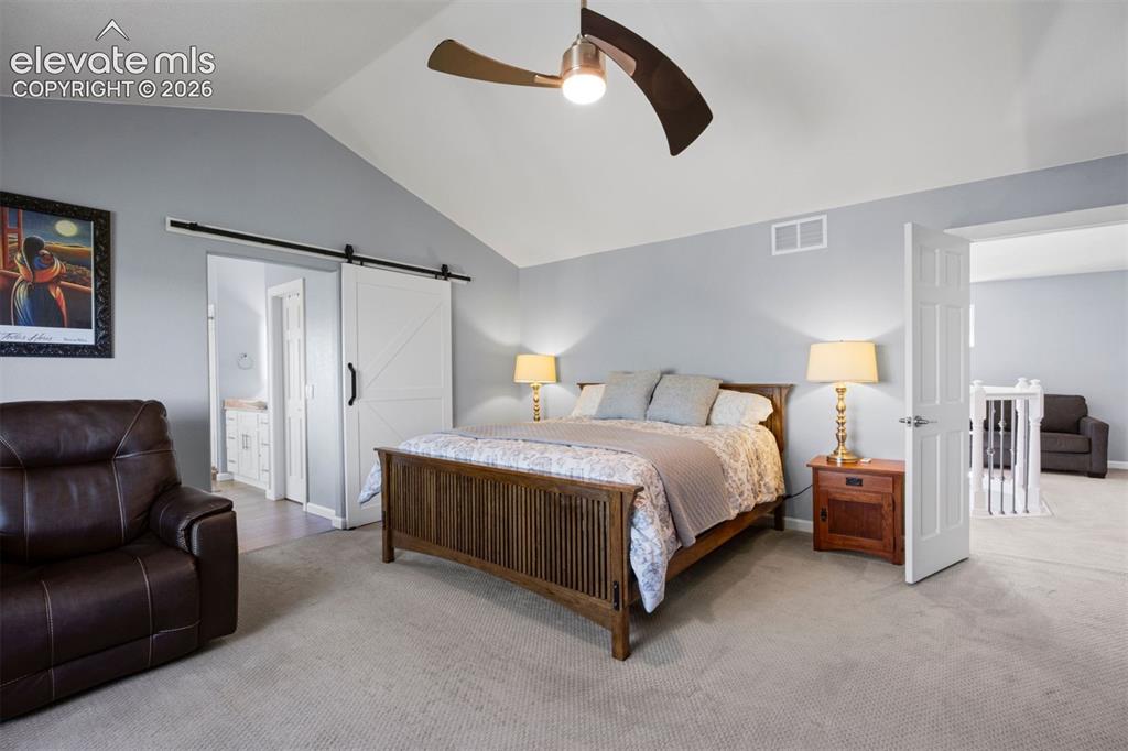 Image 6 of 50: Large primary with ensuite bathroom. Views of the famous Castle Rock.