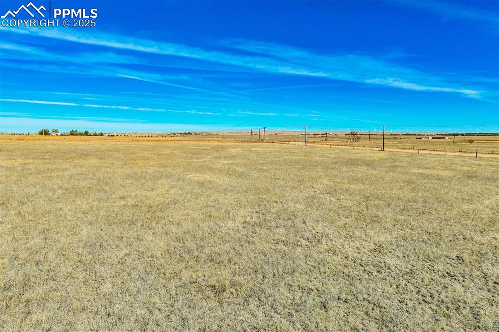 Image 13 of 20: View of yard with a rural view