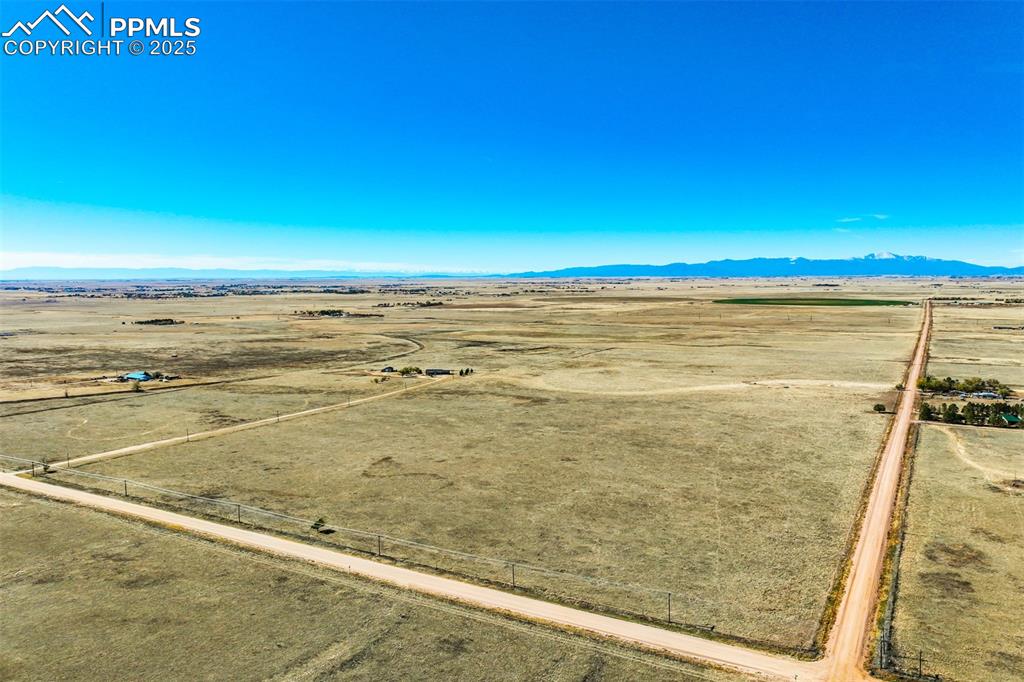 Image 19 of 20: Overview of rural landscape featuring mountains