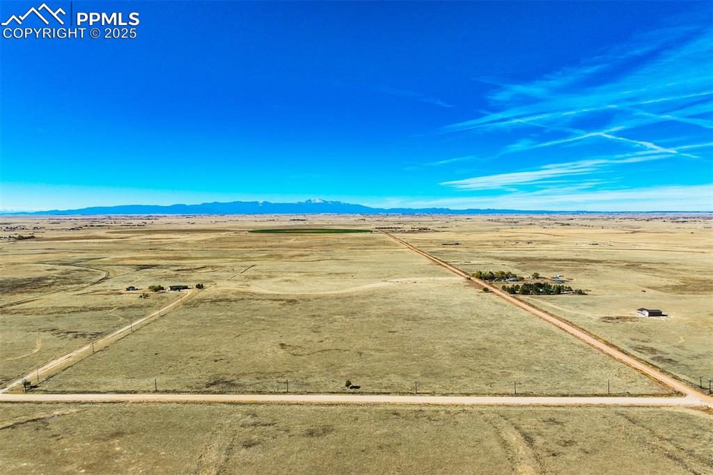 Image 2 of 20: Overview of rural landscape featuring a desert landscape and a mountain bac