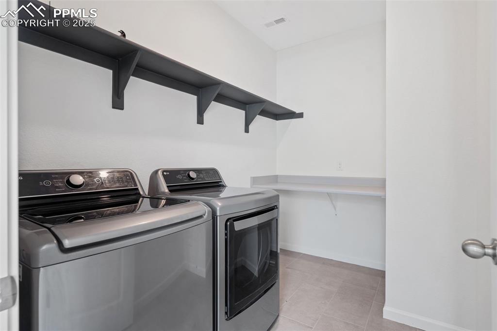 Image 13 of 42: Laundry conveniently located on upper level