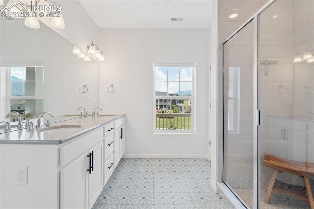 Image 18 of 42: Primary Bathroom with views