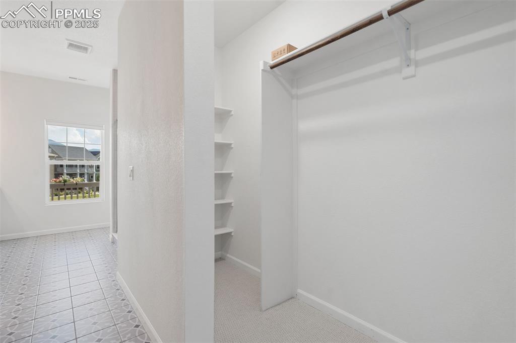 Image 20 of 42: Large Primary closet