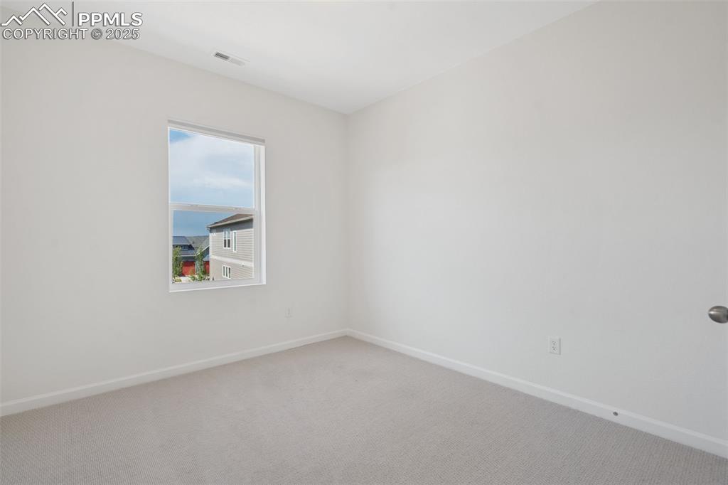 Image 23 of 42: 2nd bedroom on upper level