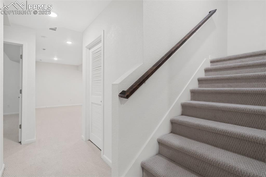 Image 28 of 42: Stairs down to basement