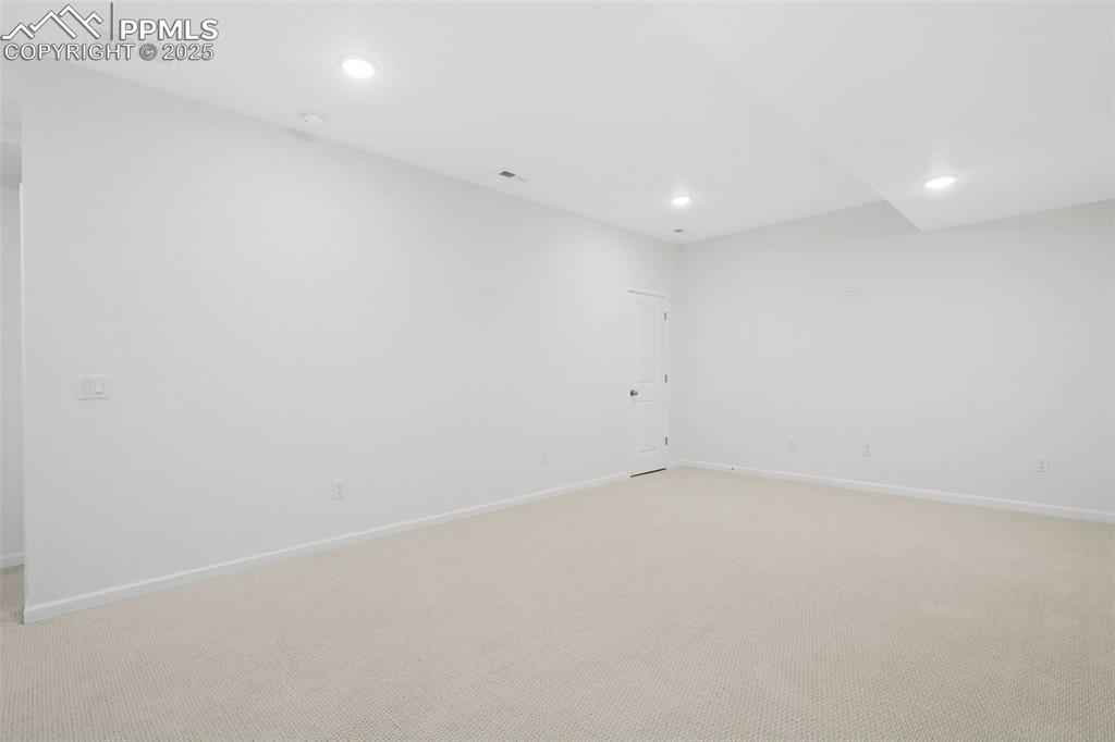 Image 29 of 42: Family room in basement could be perfect for a home theater