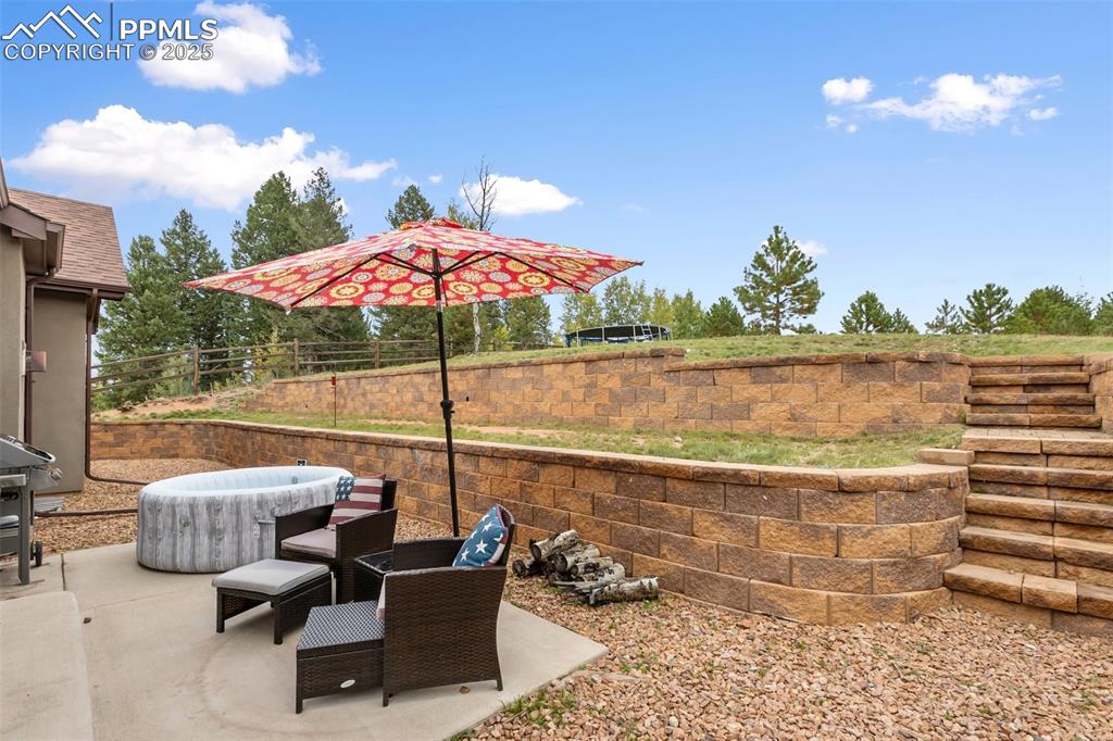 Image 14 of 44: Versatile patio space with ample room for many entertaining uses.
