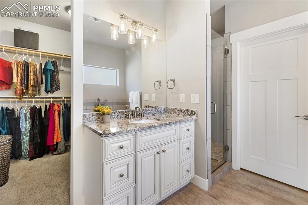 Image 21 of 44: Large walk in closet adjacent to the walk in closet.