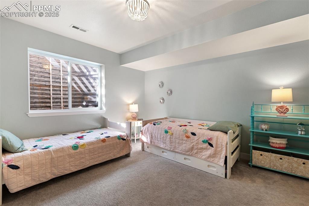 Image 38 of 44: Lower level bedroom