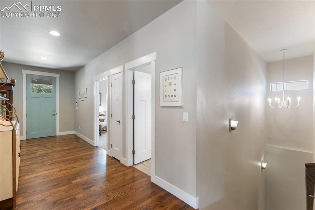 Image 42 of 44: Entry way with hardwood flooring throughout