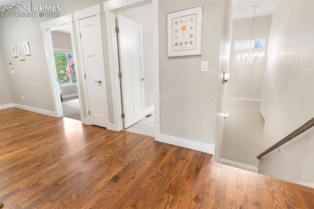 Image 43 of 44: Well designed floorpan with wide staircase leading downstairs from the main