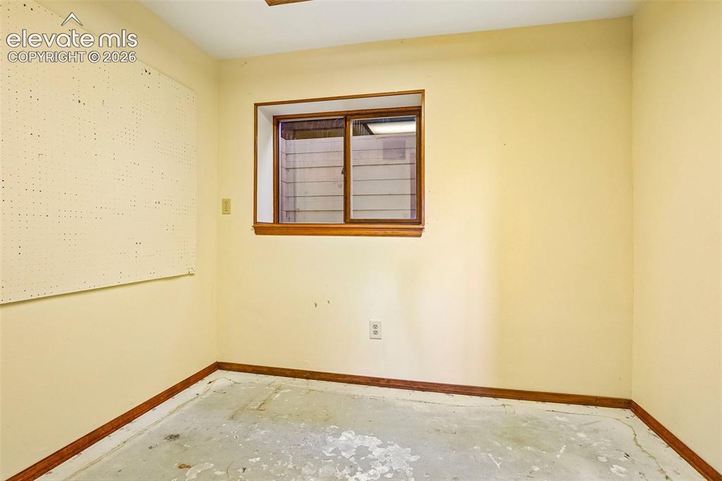 Image 22 of 48: The basement features a space that could be for crafts, workshop or storage