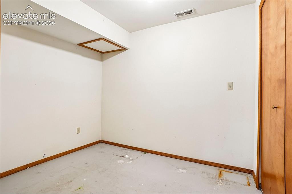 Image 23 of 48: This room in the basement was used as storage.