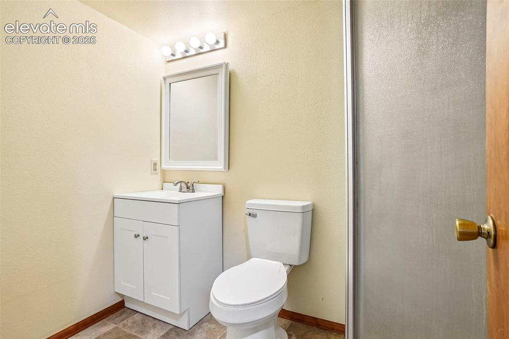 Image 24 of 48: Basement bathroom has shower.