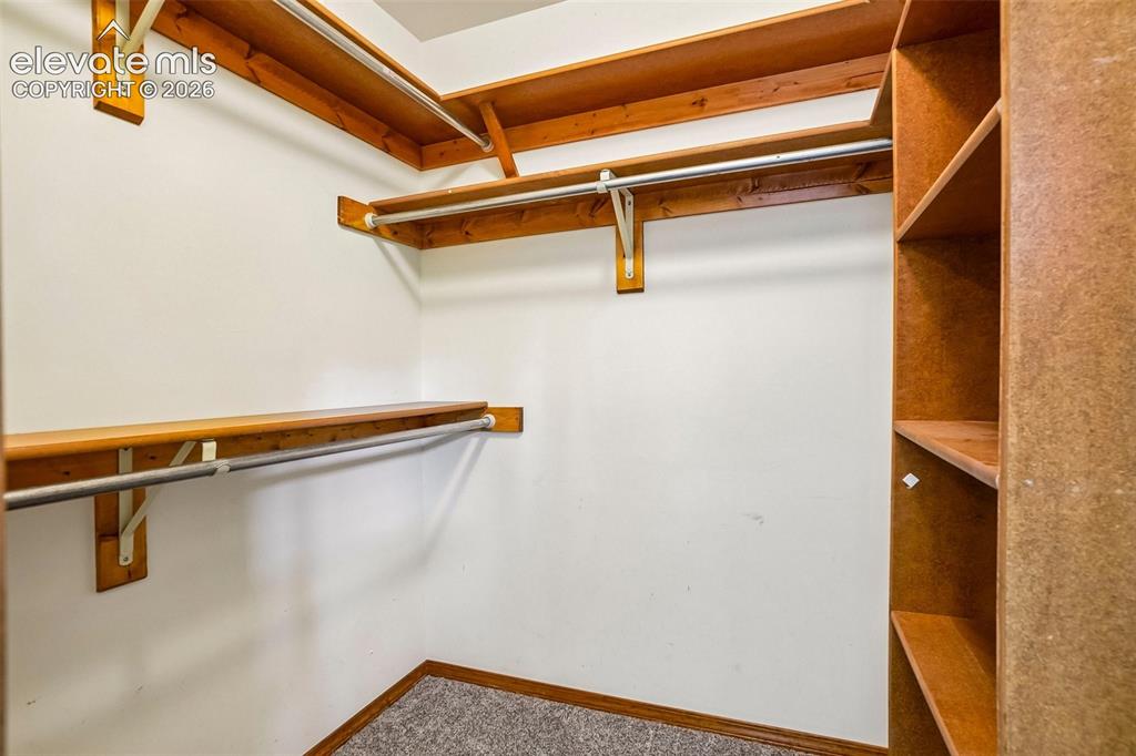 Image 29 of 48: Primary closet.