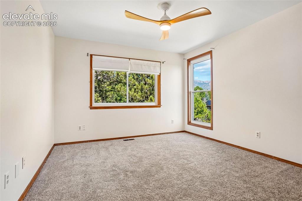 Image 30 of 48: Upstairs bedroom with killer views! 