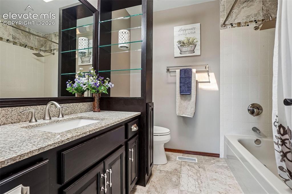 Image 32 of 48: Hall bathroom serves three other bedrooms upstairs.