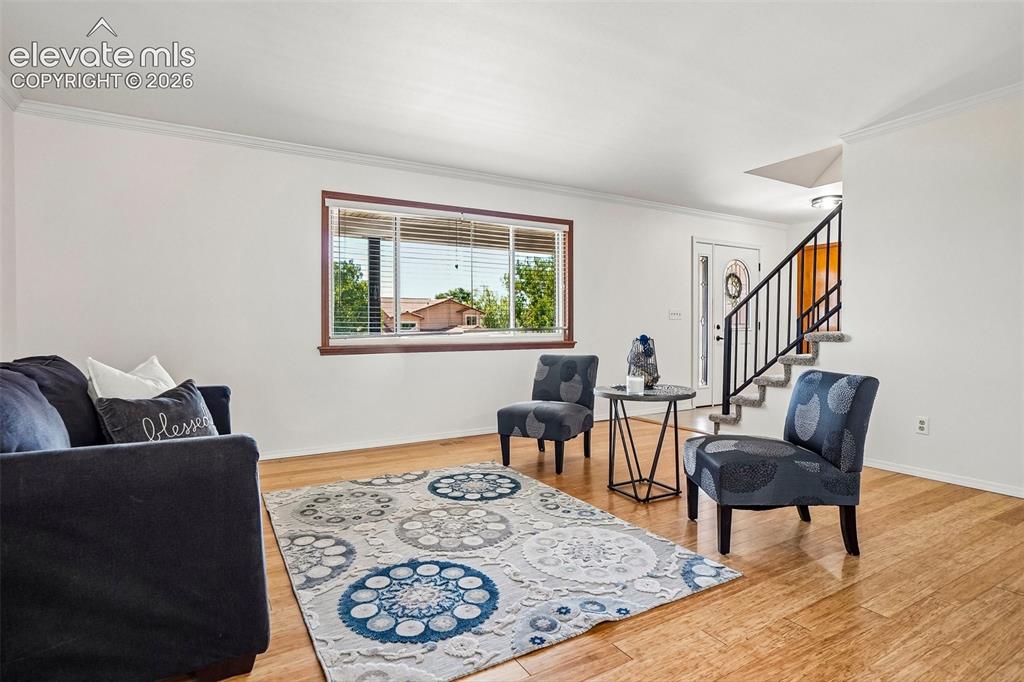 Image 7 of 48: Huge picture window in formal living room.