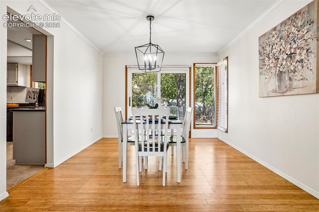 Image 8 of 48: Formal dining area includes walkout to huge rear deck! 