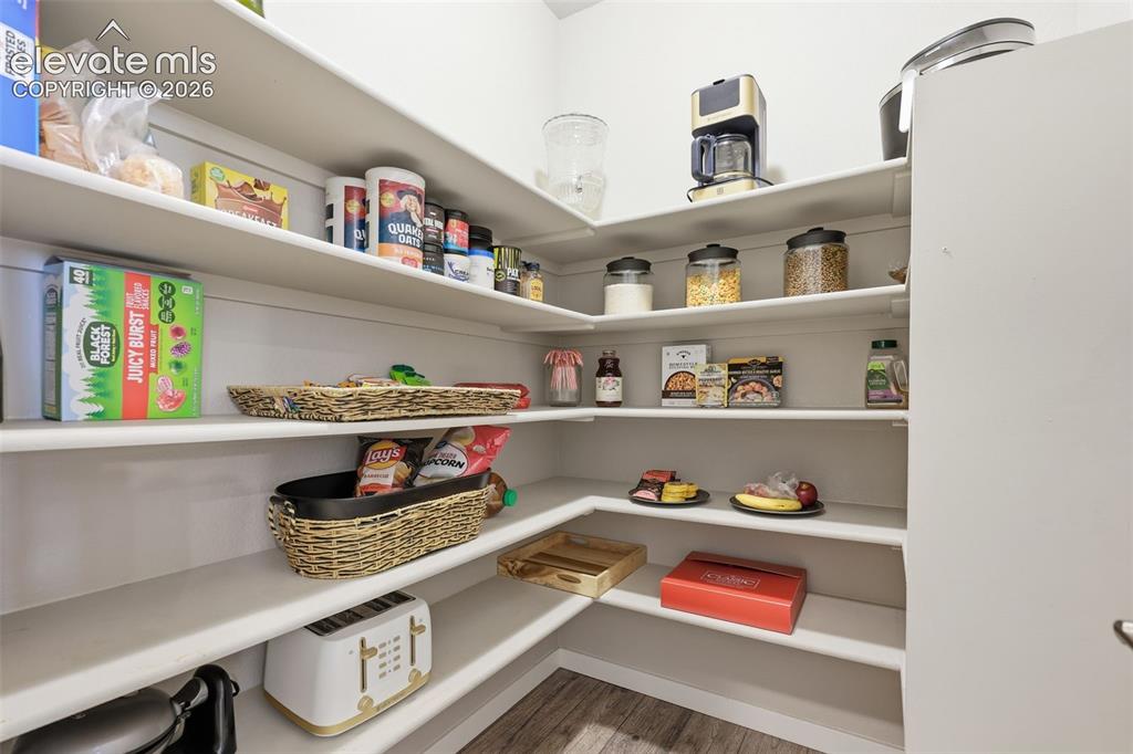 Image 12 of 43: Wraparound shelving providing extensive storage.