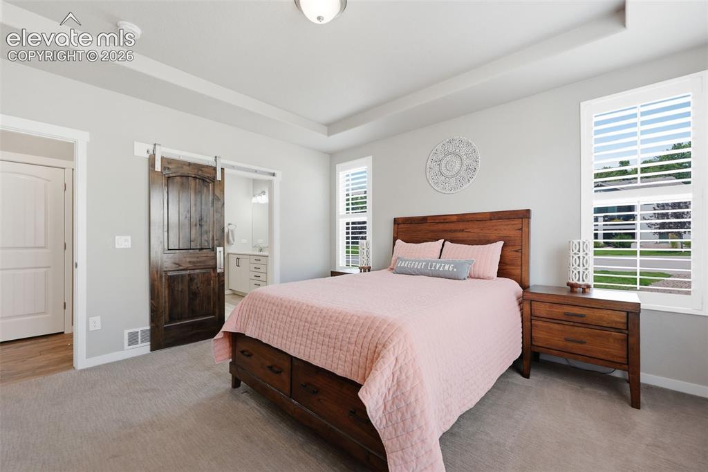 Image 18 of 43: Tray ceiling with recessed lighting.