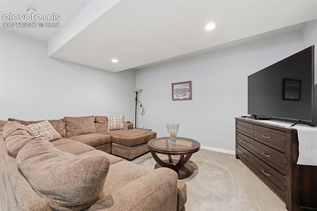 Image 26 of 43: Recessed lighting illuminates the space, featuring light gray walls and lig